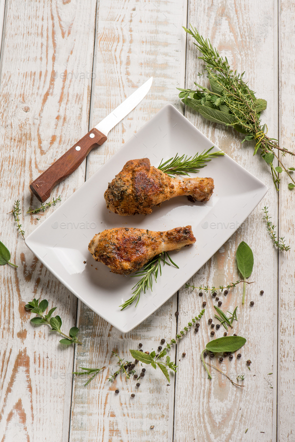 oven breaded chicken legs with herbs Stock Photo by PhotoDune